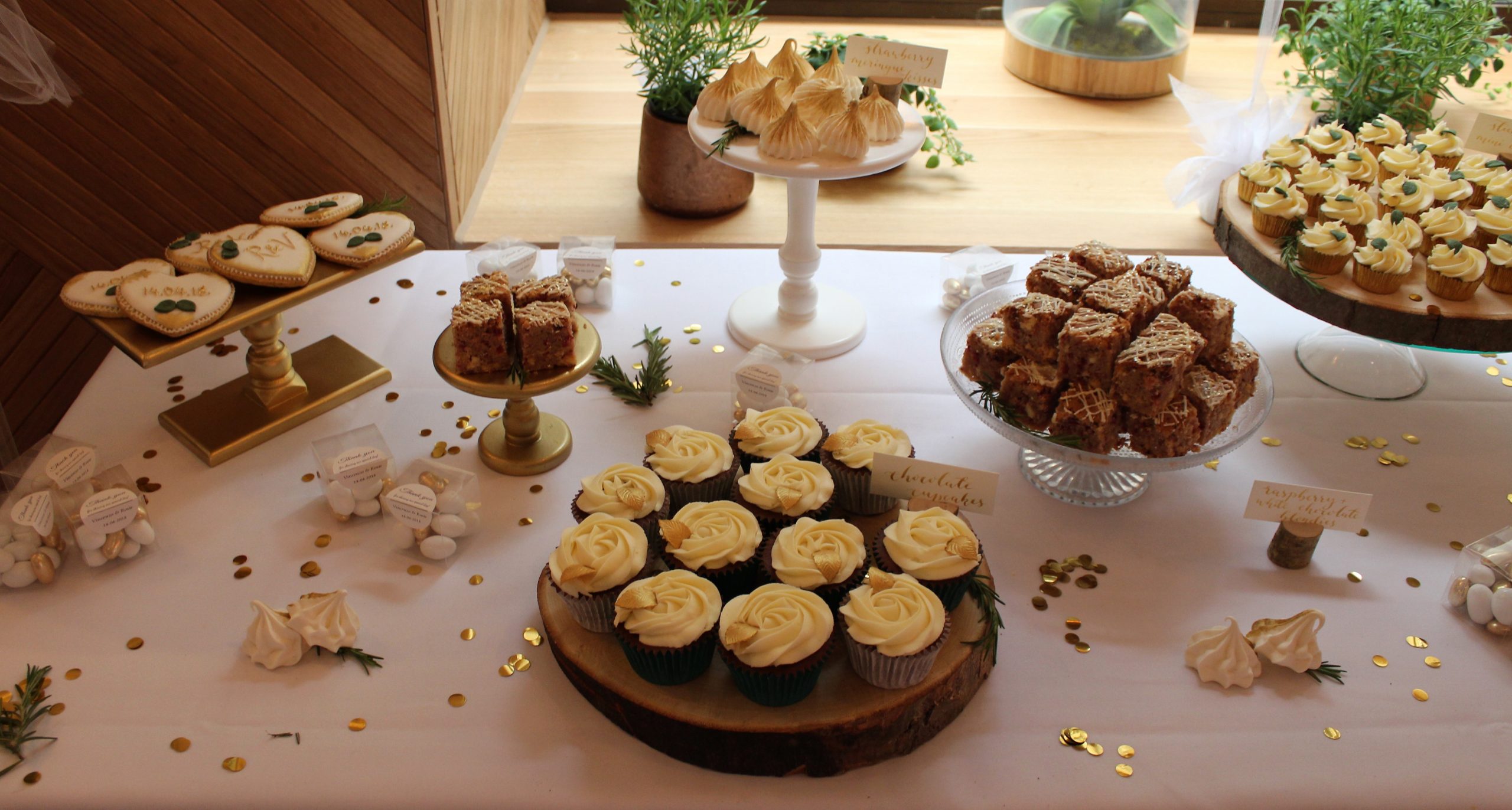 luxury dessert table london meringue kisses mini cupcakes blondies macarons biscuits